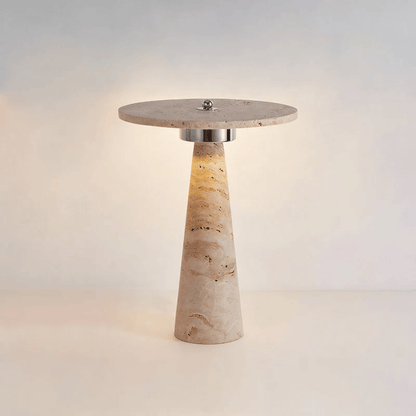 Table lamp with stone-like base and round top on a light background