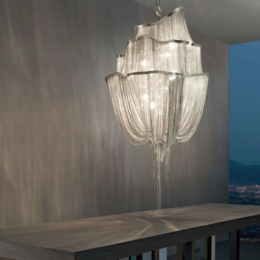 Chandelier hanging above a table with a scenic view in the background