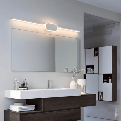 Modern bathroom vanity with mirror, lighting fixture, and decorative elements.