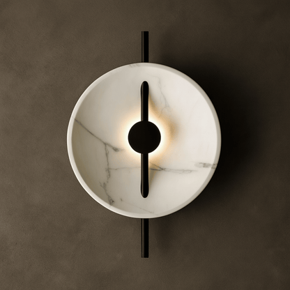 Modern wall light fixture with marble-like finish and black accents on a dark background