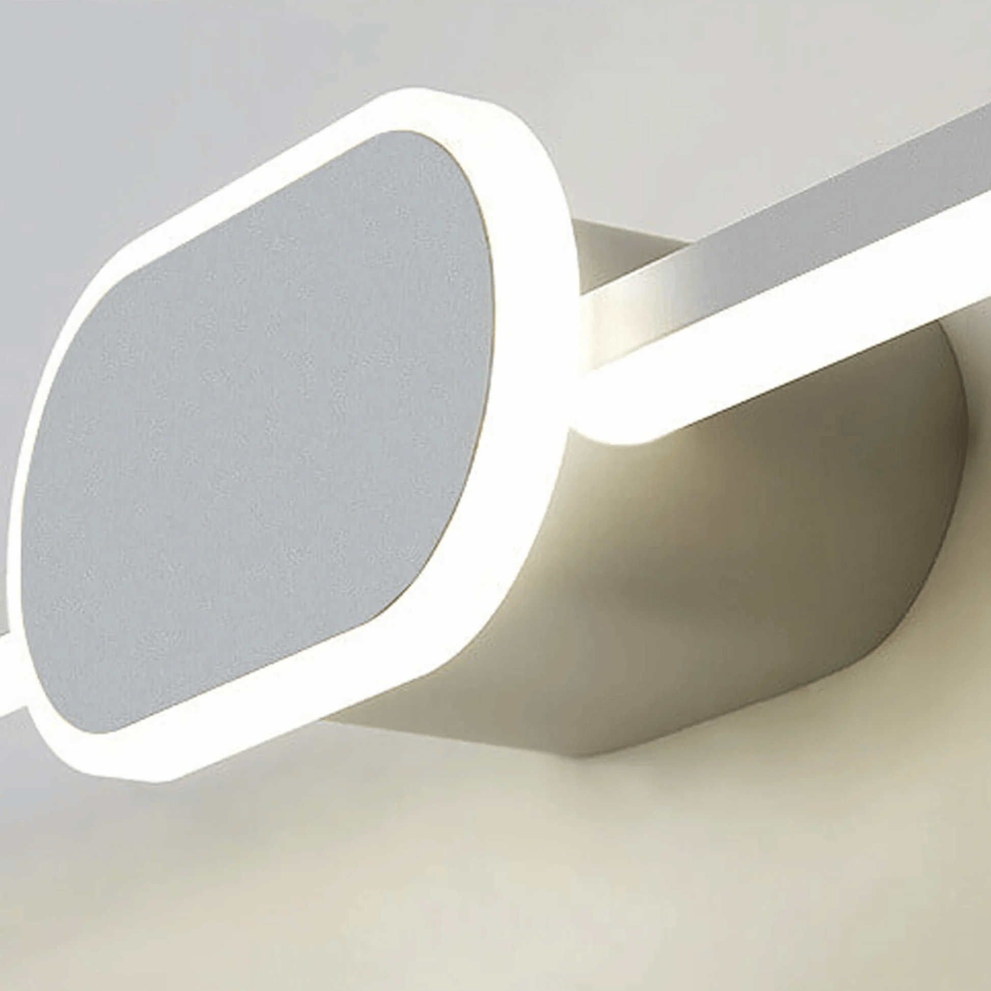 Sunglasses with a geometric lens design on a light gray background