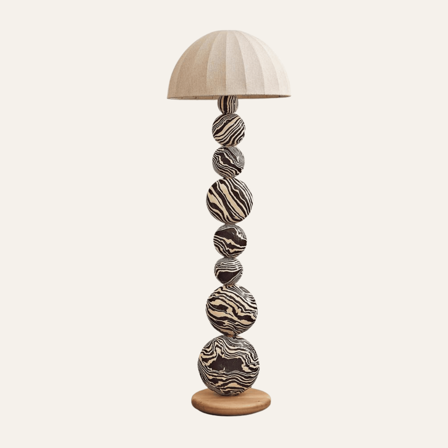 Decorative floor lamp with marble-like design on a white background