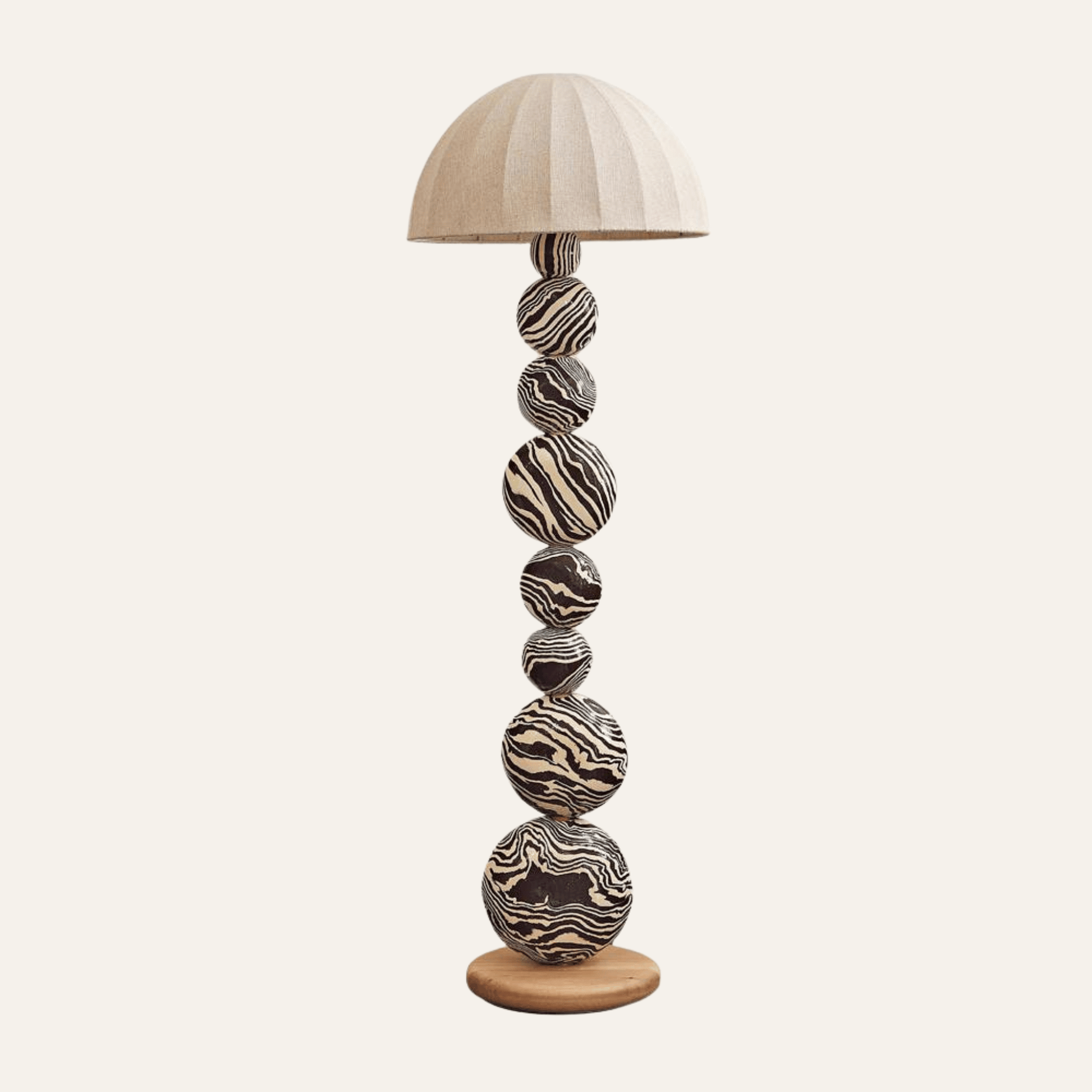 Decorative floor lamp with marble-like design on a white background