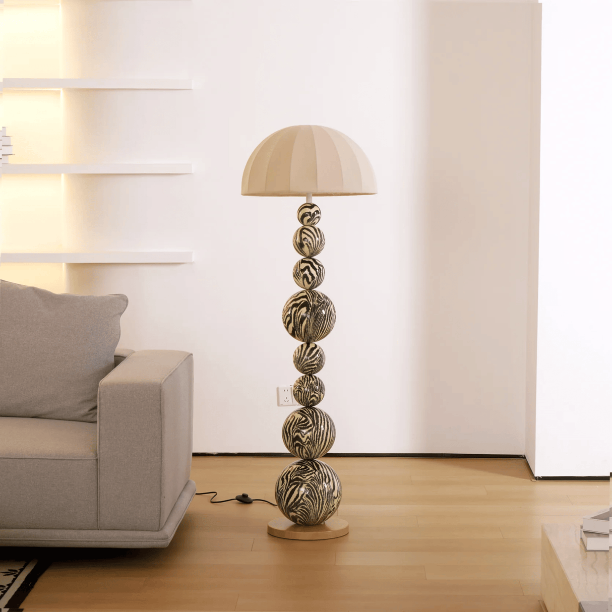 Decorative floor lamp with unique design in a living room setting.
