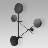 Modern wall lamp with four round black shades on a white background