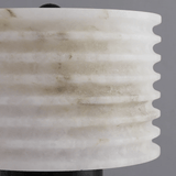 Close-up of a marble-textured vase against a gray background