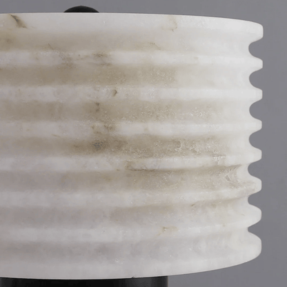 Close-up of a marble-textured vase against a gray background