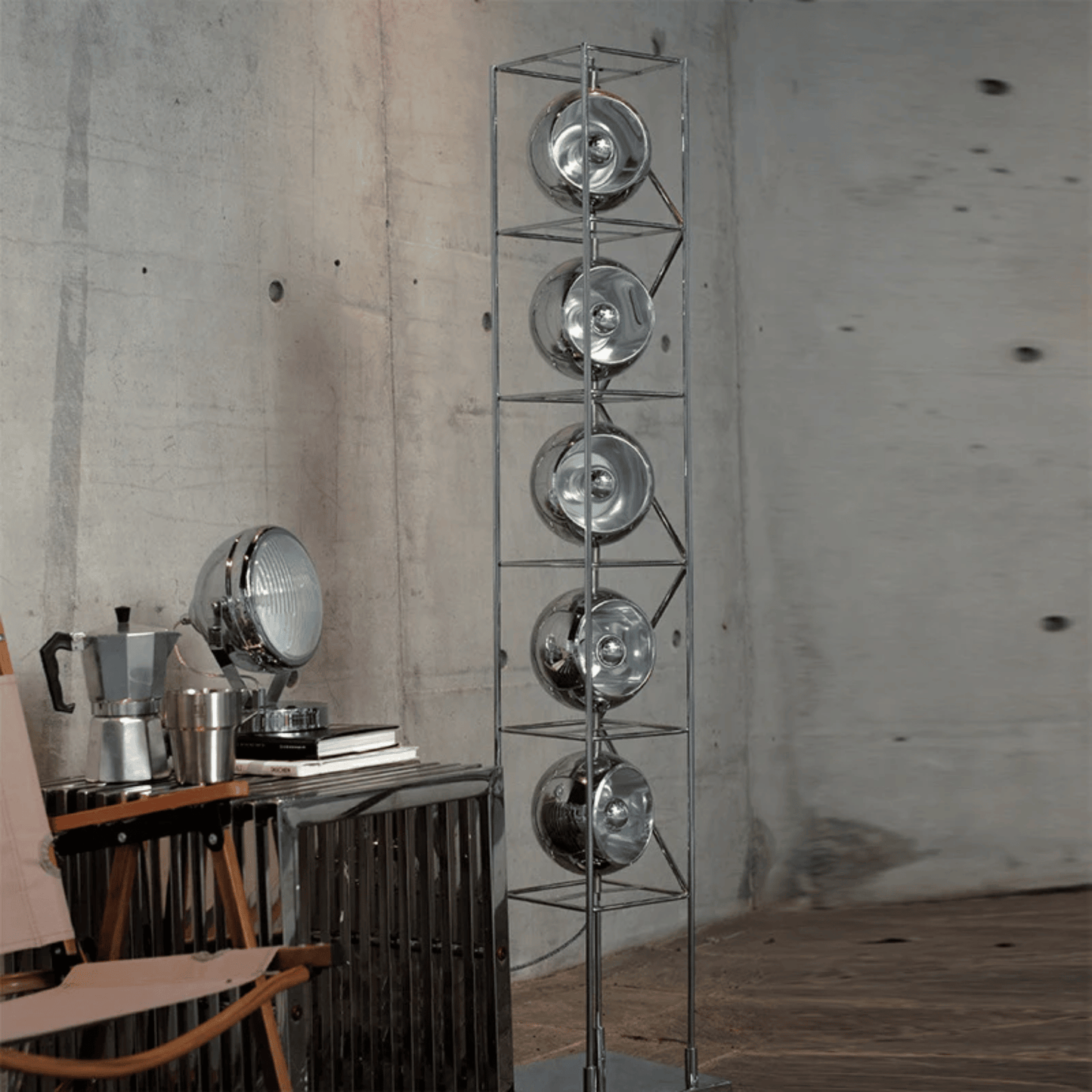 Metallic floor lamp with circular design elements in a room setting.