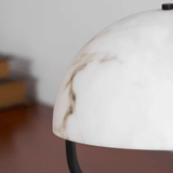 Close-up of a white lampshade with a blurred background