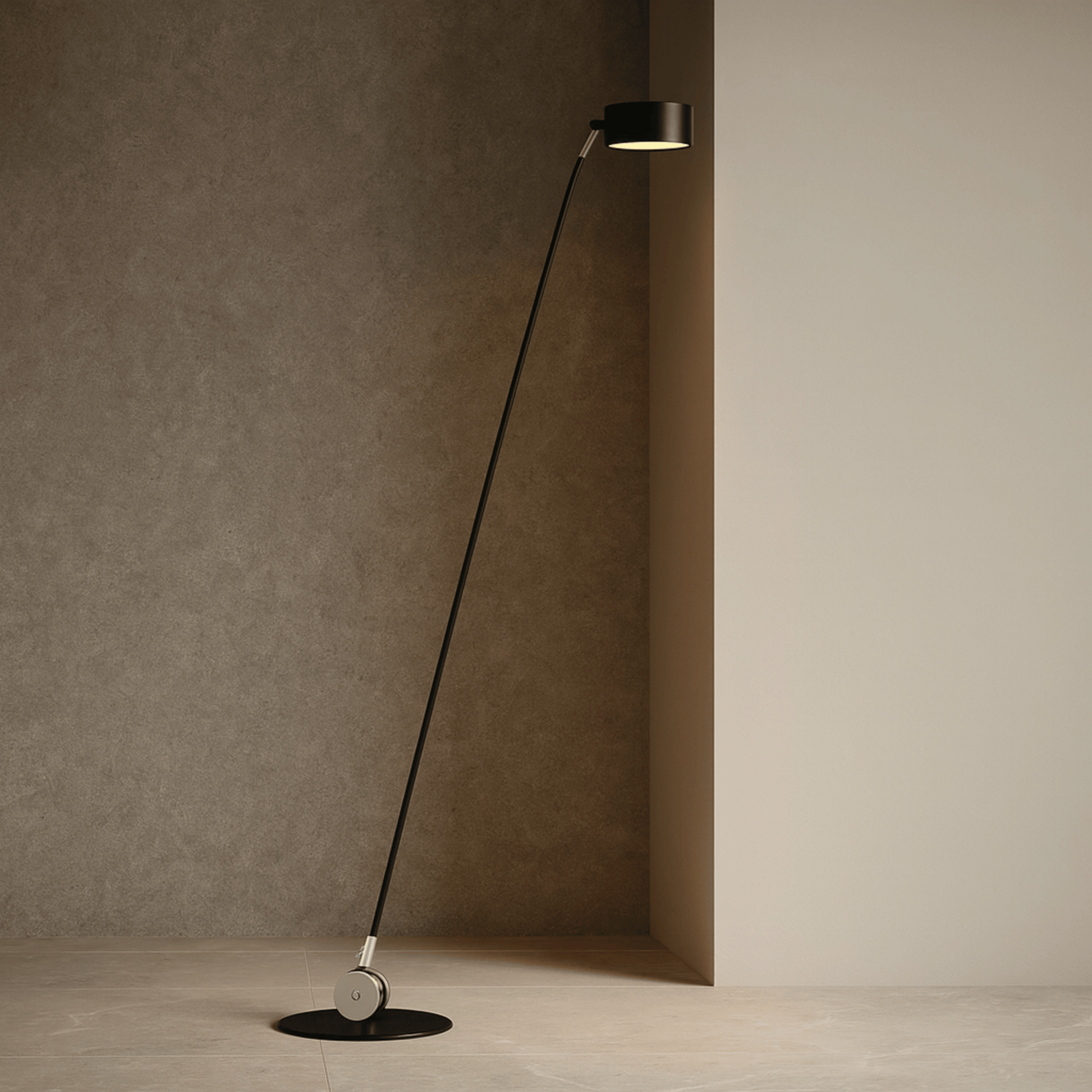Modern floor lamp with long black cable against a neutral wall.