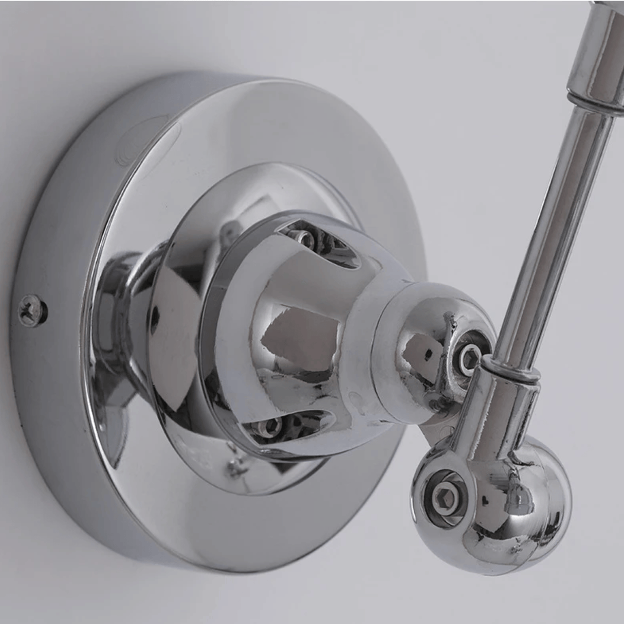 Chrome shower valve and handle on a white background