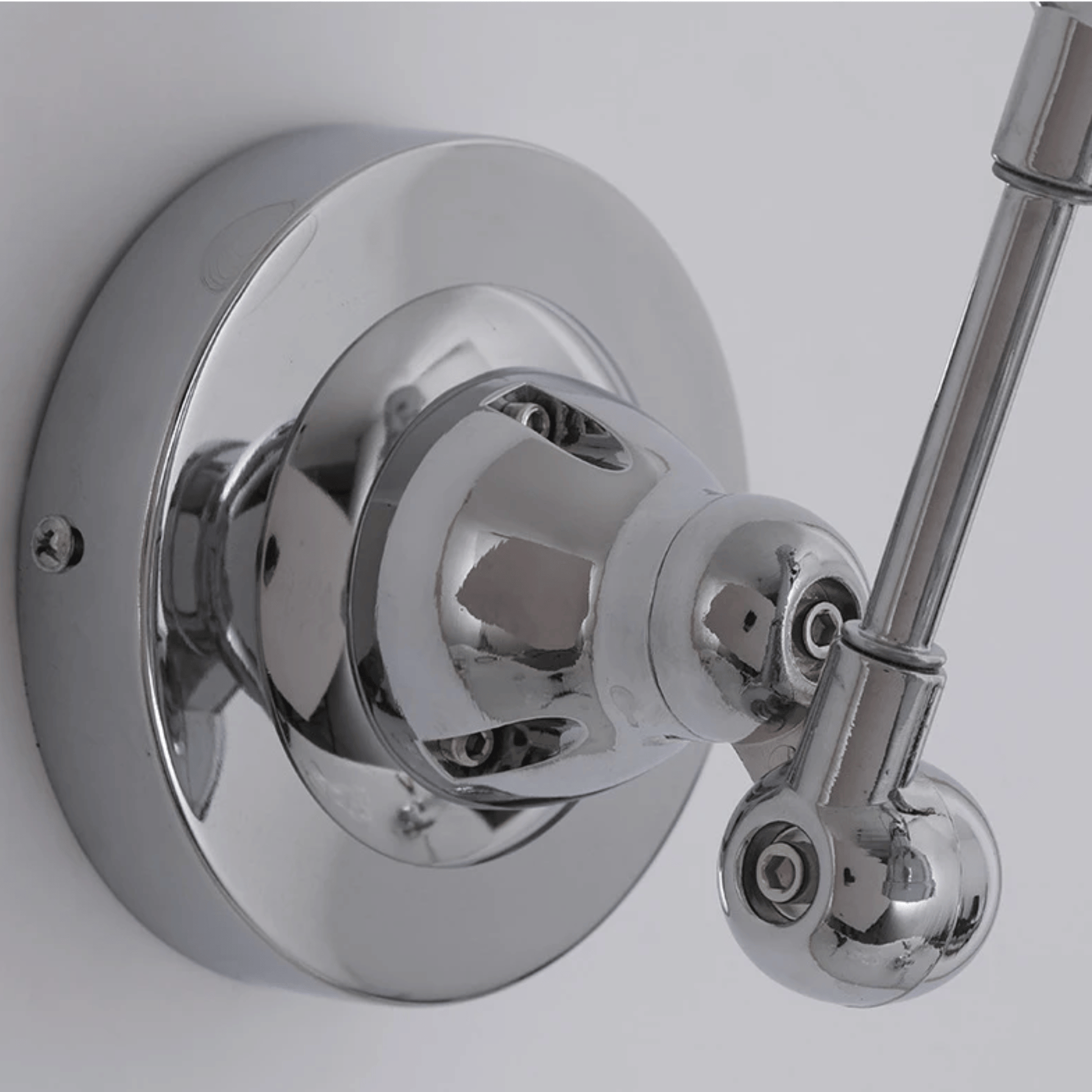 Chrome shower valve and handle on a white background