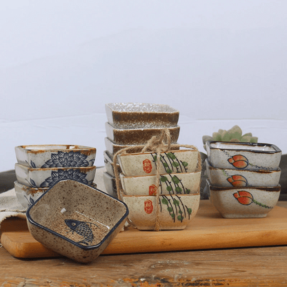 Set of ceramic bowls with various designs on a wooden surface