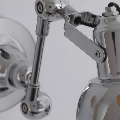 Close-up of a chrome shower valve and handle on a white background