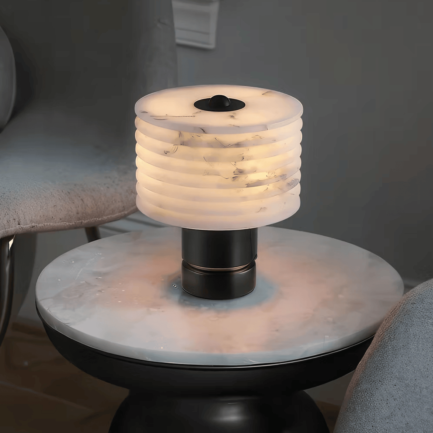 Decorative lamp on a round marble table with a neutral background