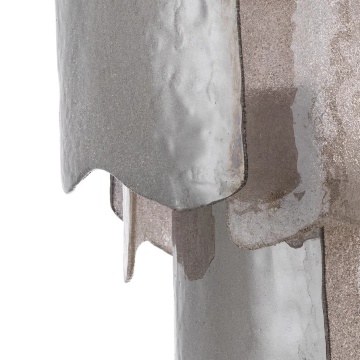 Close-up of a textured stone surface with a focus on the material's texture and color.