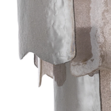 Close-up of a textured stone surface with a focus on the material's texture and color.