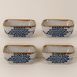 Four square ceramic bowls with blue floral patterns and brown edges on a white background