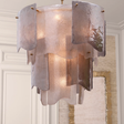 Decorative ceiling light fixture with metallic finish in a room setting