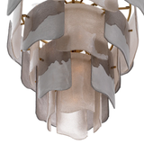Decorative lamp with layered fabric shades on a white background