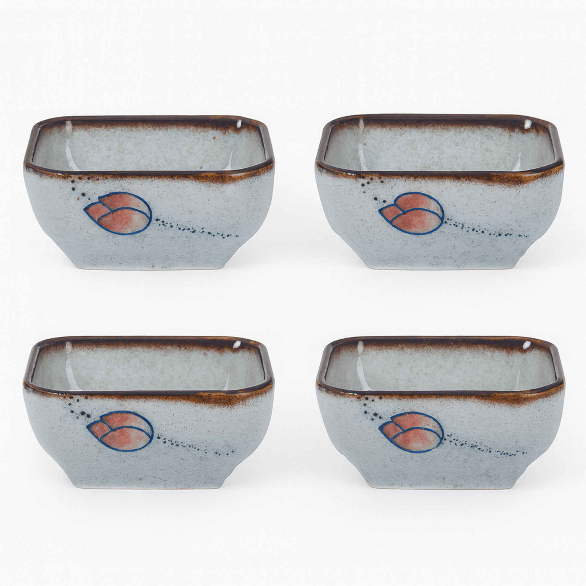 Four ceramic bowls with a decorative design on a white background