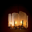 Modern chandelier with glass shades on a dark background
