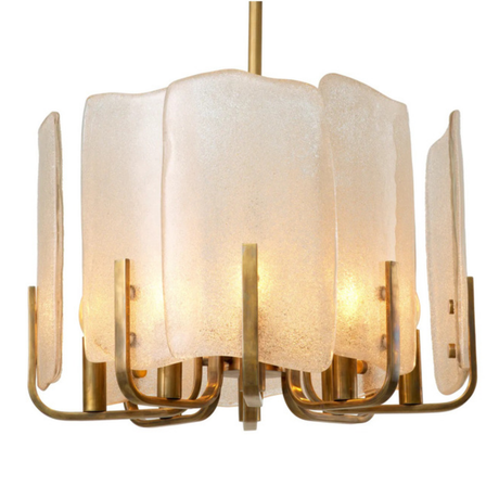 Chandelier with white glass shades and gold metal frame on a white background