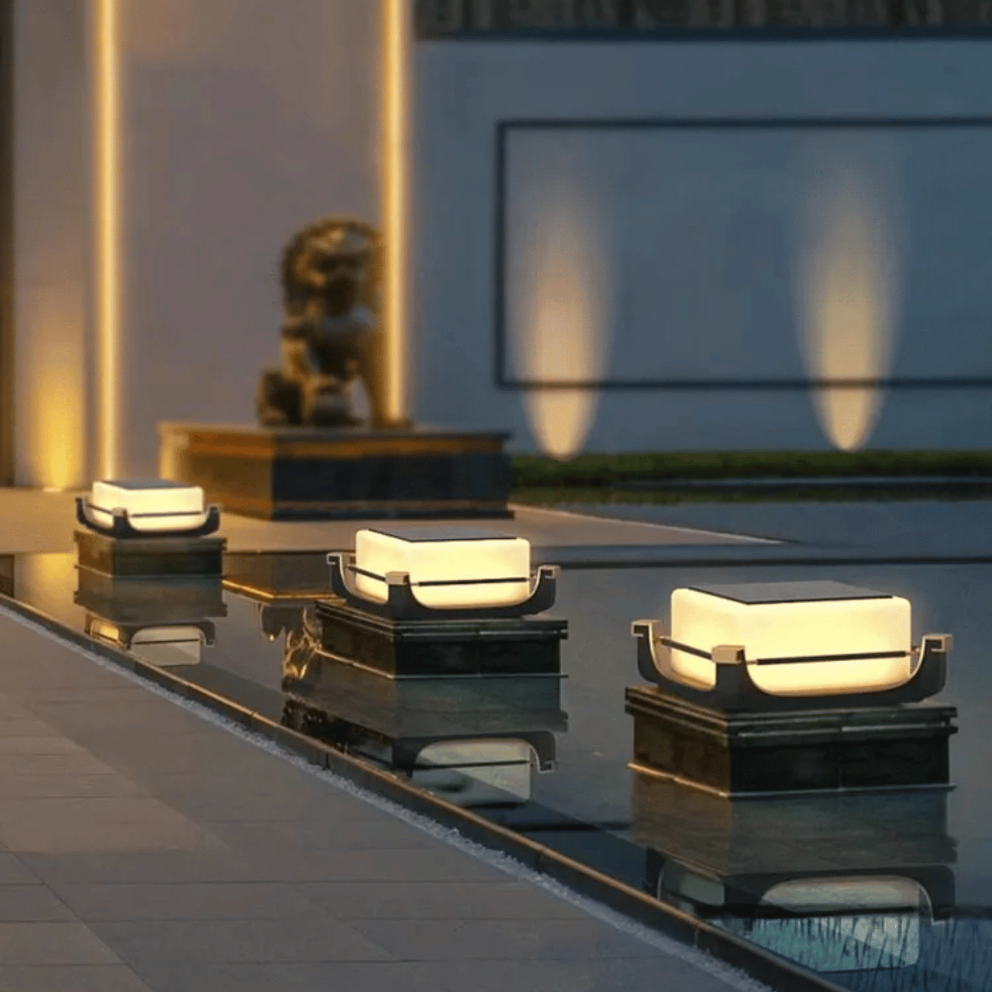 Modern outdoor lights on a reflective surface with a blurred background