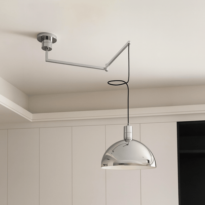 Modern pendant light with adjustable arm in a neutral setting