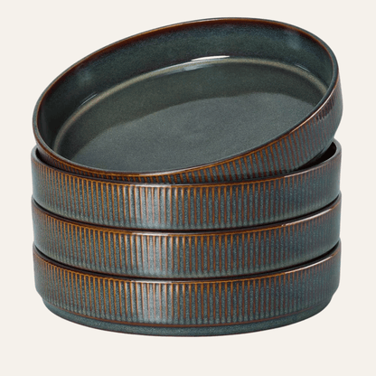 Set of three ceramic bowls with a textured surface on a white background