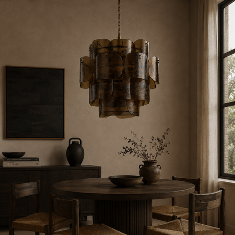 Dining room with a large pendant light fixture, round table, and chairs.
