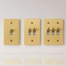 Three beige light switch covers with different numbers of switches on a white background