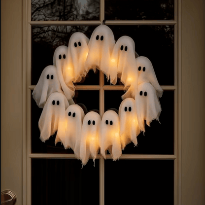 Halloween wreath with ghost decorations on a door