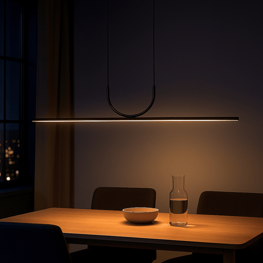 Modern dining area with a pendant light, table, chairs, and a bottle on a dark background