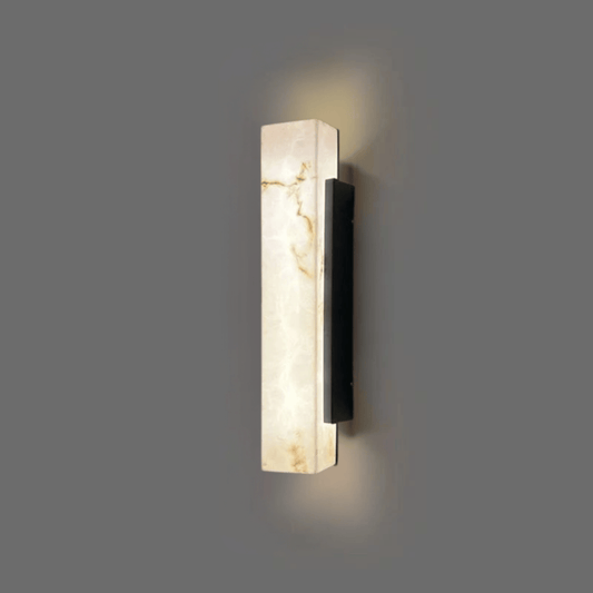Modern wall sconce with marble-like finish on a gray background