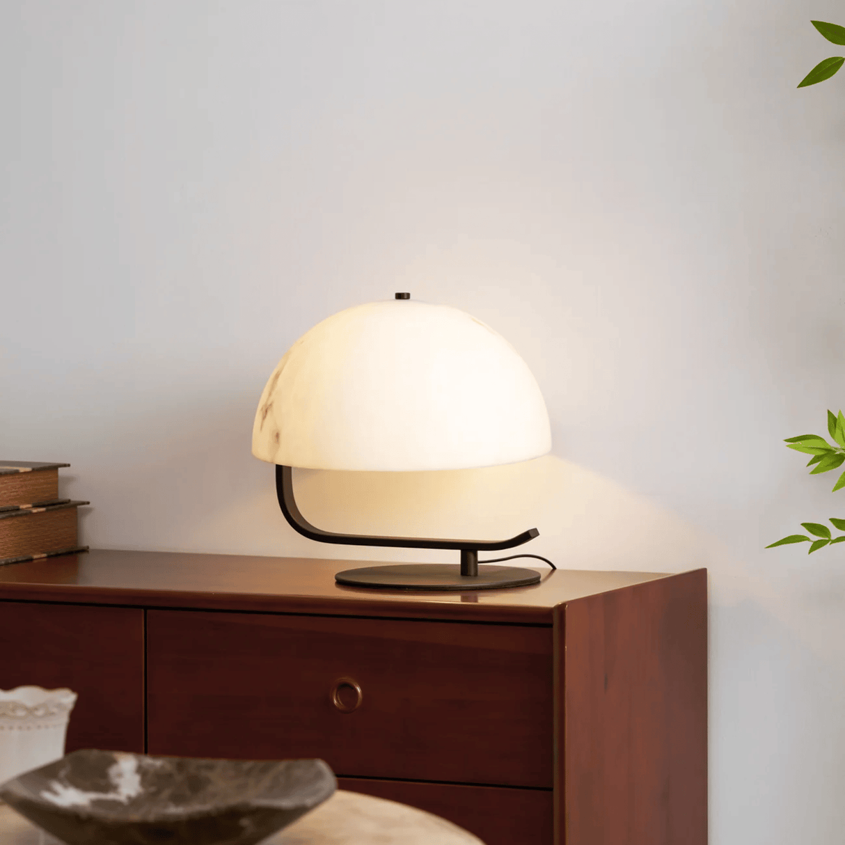 Table lamp on a wooden side table with a neutral background