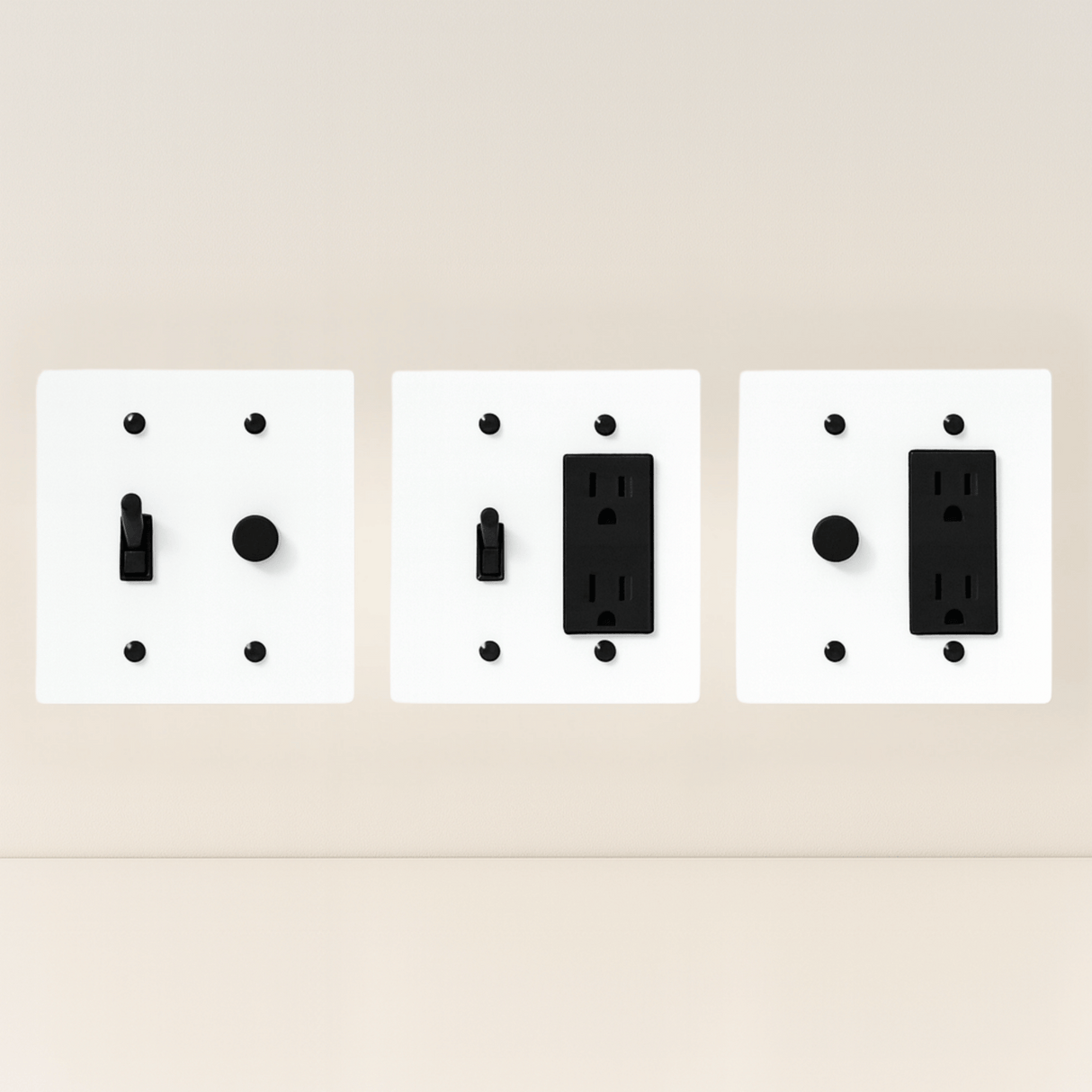 Three white wall plate covers with black outlets on a beige background