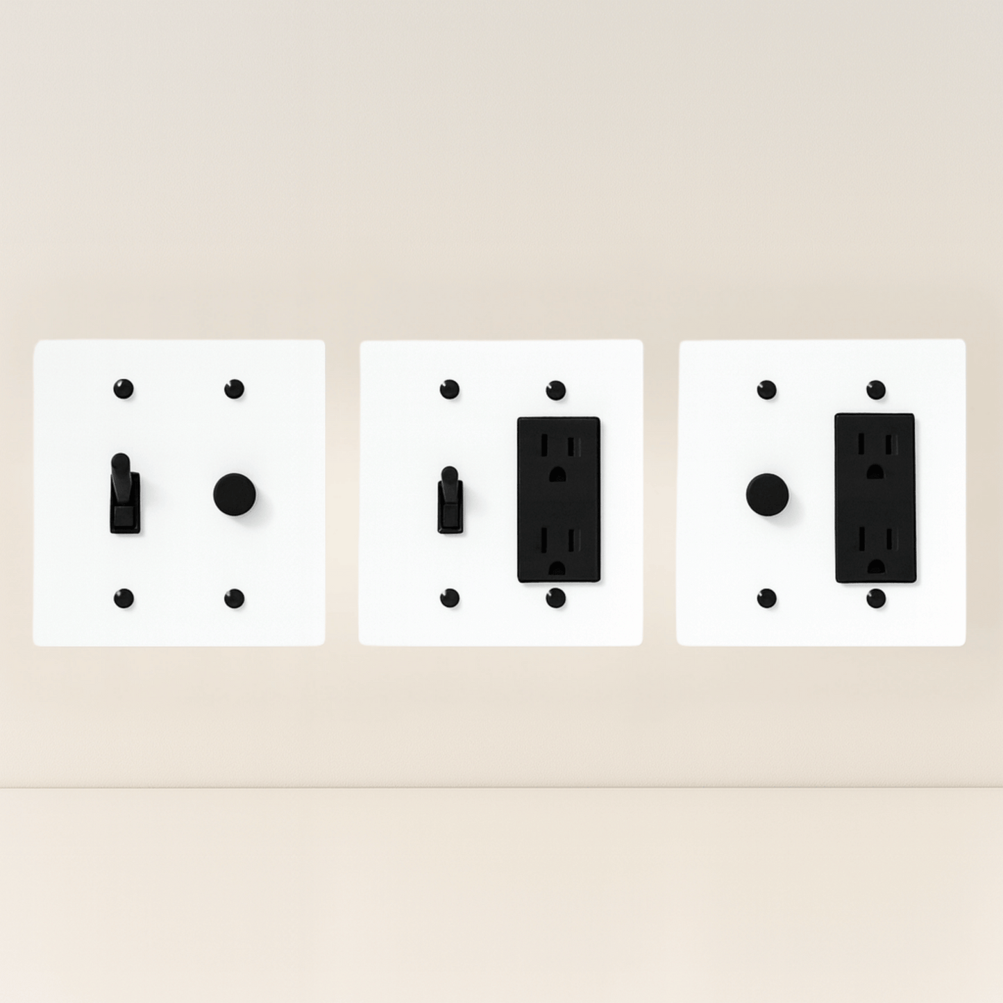 Three white wall plate covers with black outlets on a beige background