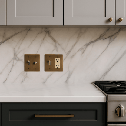 Kitchen with marble backsplash, wooden wall outlets, and stainless steel stove.
