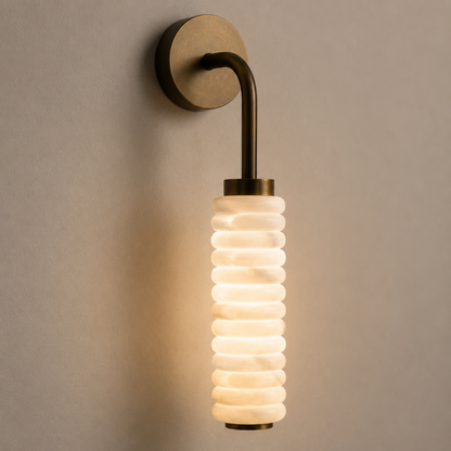 Wall-mounted light fixture with ribbed glass shade on a beige wall