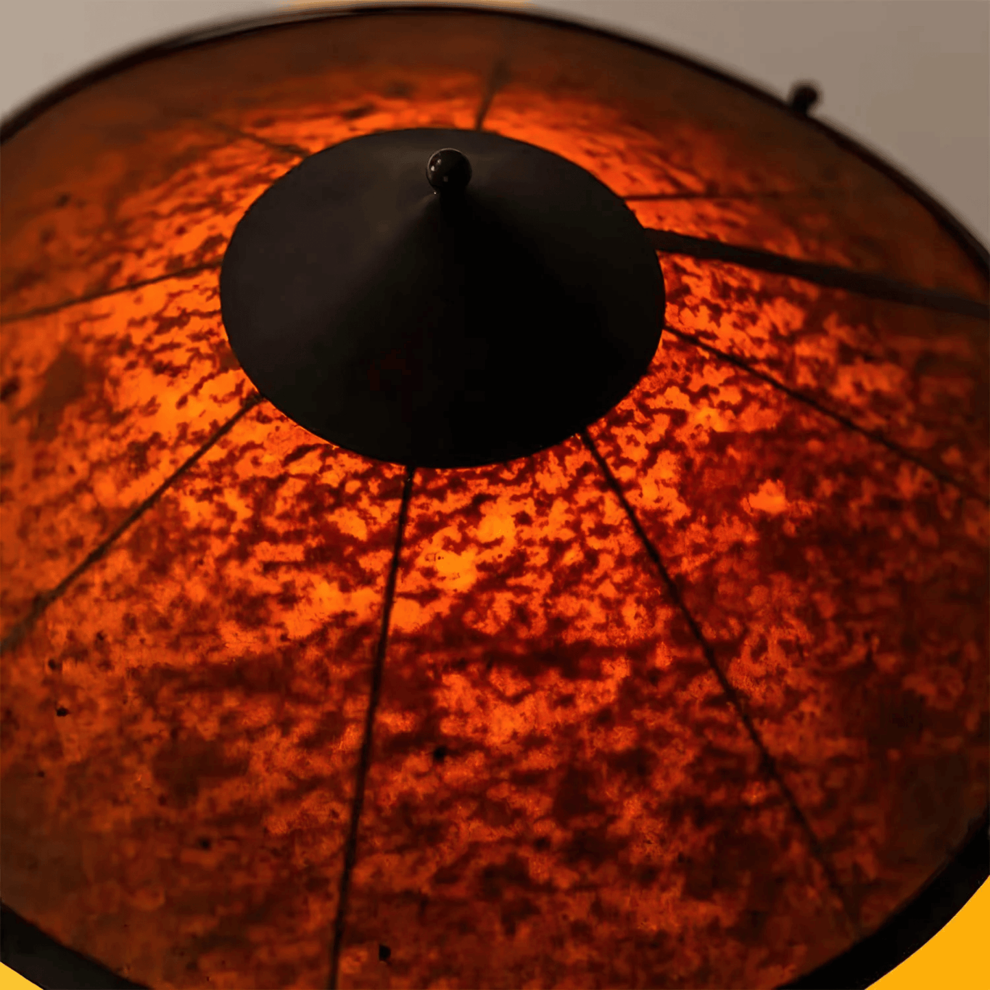 Close-up of a textured red surface with a black circular object on top