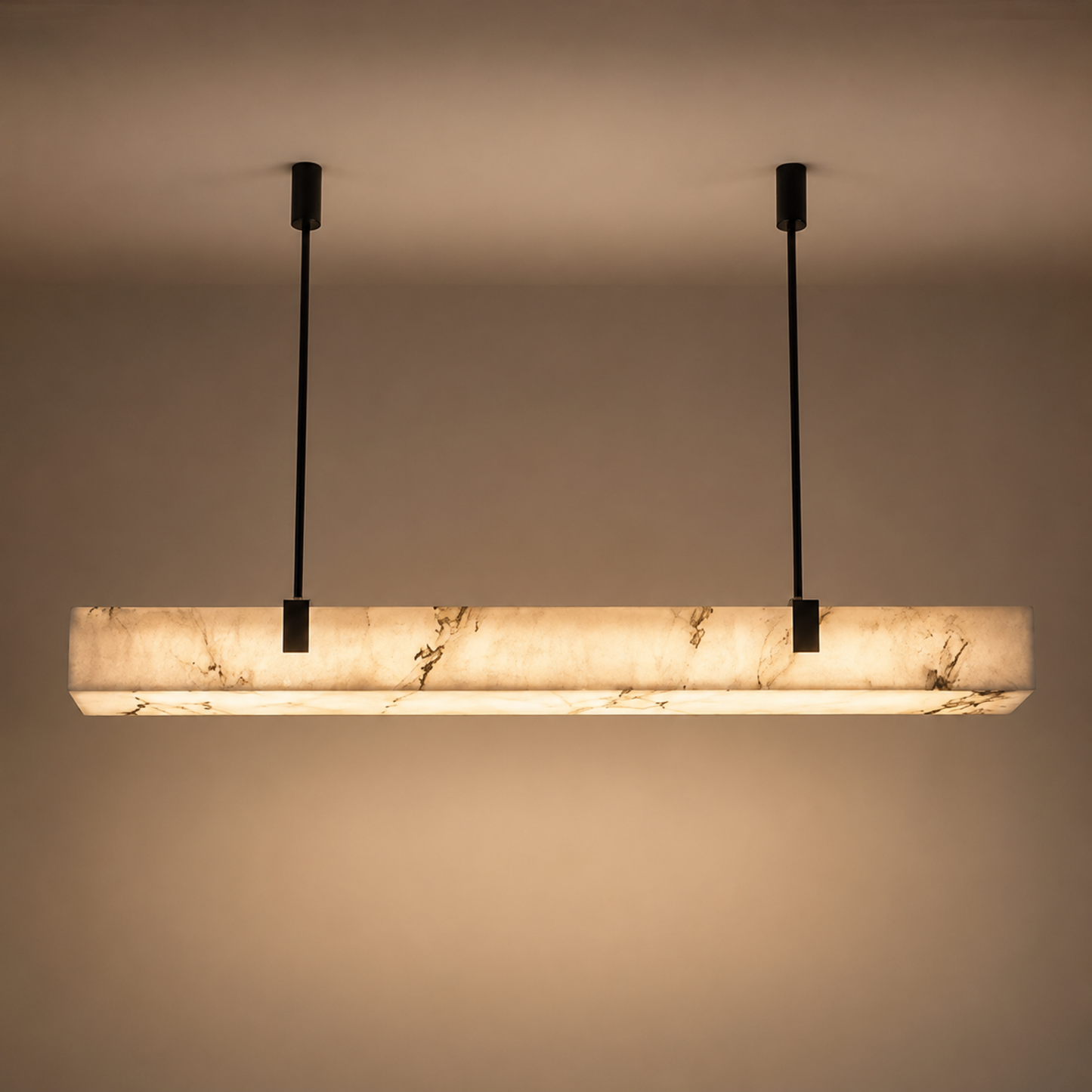 Modern pendant light with marble-like finish on a plain background
