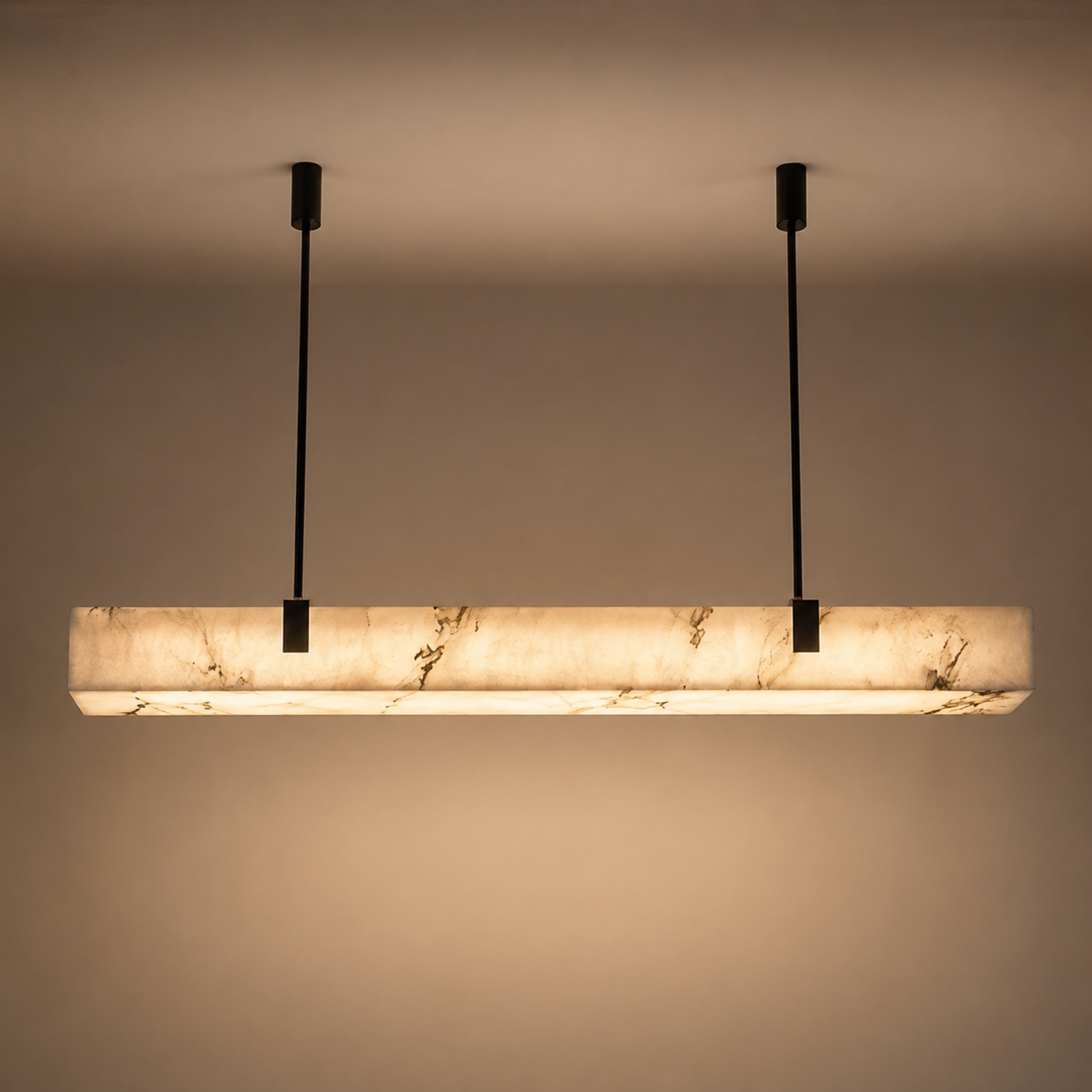 Modern pendant light with marble-like finish on a plain background