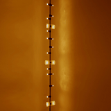 String of lights against a warm orange wall