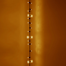 String of lights against a warm orange wall