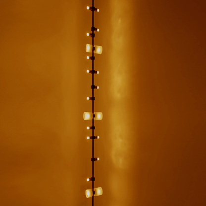 String of lights against a warm orange wall