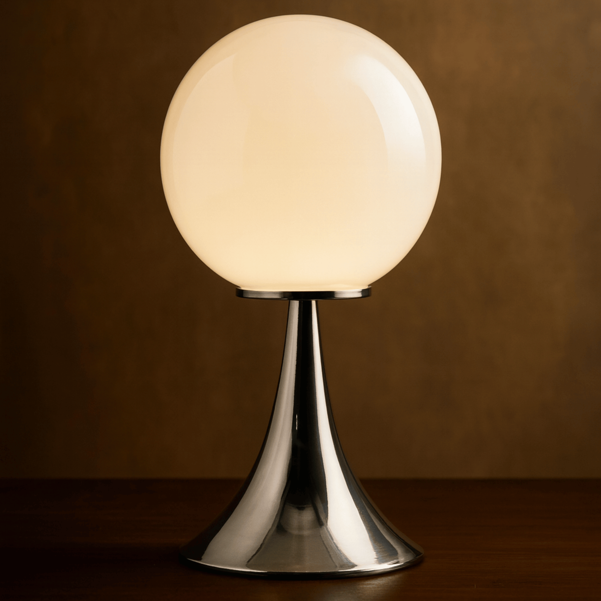 Table lamp with a spherical glass shade on a dark background