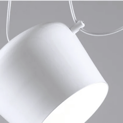 Close-up of a white pendant light against a gray background