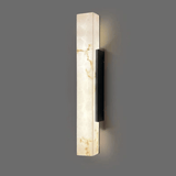 Wall-mounted light fixture with marble-like finish on a gray background