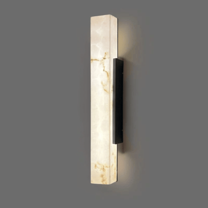 Wall-mounted light fixture with marble-like finish on a gray background